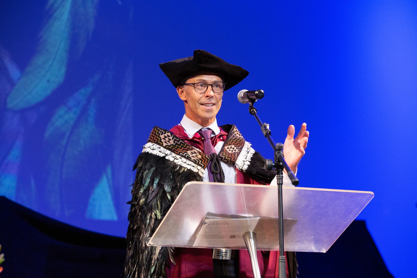 Monique Lee and Sela Kivalu giving a speech at Graduation 2021