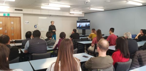 Dr Christa McKirland teaching a class using Computer on Wheels (COWs)