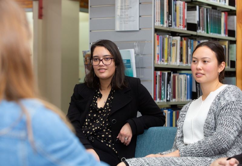 Two female students in the library