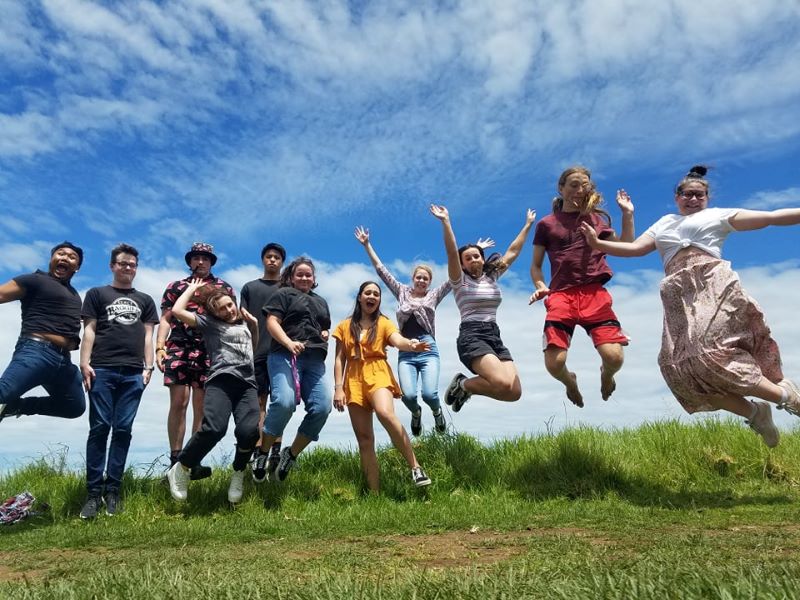 Intermission_Linking Tile_2020 Intermission Students jumping on a hill